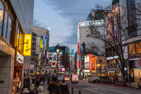 Tokyo, Japan - January 8, 2020. Many people walking along the busy streets and crossing at the famous Shibuya Crossing just around sunset. Shibuya is one of the most famous intersections in Tokyo.のeditorial素材