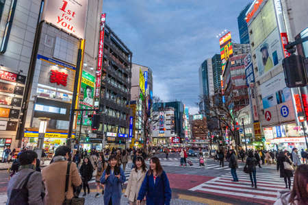 Tokyo, Japan - January 8, 2020. Many people walking along the busy streets and crossing at the famous Shibuya Crossing just around sunset. Shibuya is one of the most famous intersections in Tokyo.のeditorial素材