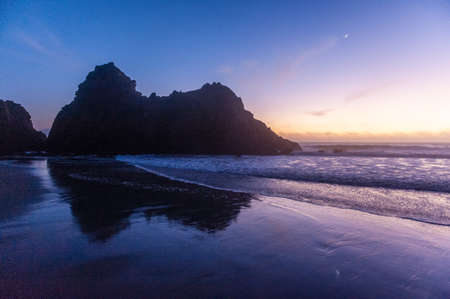 Impression of the keyhole arch rock at Pfeiffer beach around sunset.