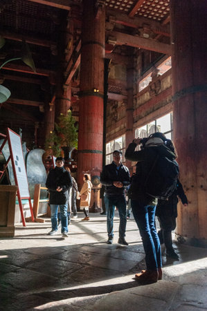 Nara, Japan - January 5, 2020. Visitors experiencing the Todai-ji Temple in Nara. This temple is famous for its giant Buddha statue and a popular tourist destination.のeditorial素材