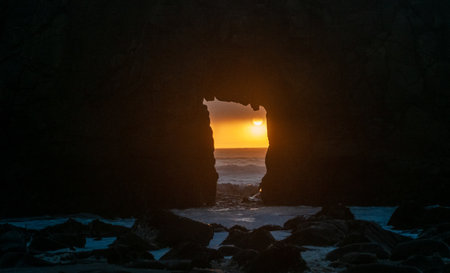 Detail of the Keyhole arch at Pfeiffer beach, with the setting sun to be just behind it.の写真素材