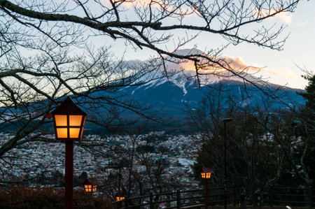 Shimoyoshida, Japan - December 27, 2019. Traditional Japanese lanterns illuminating mount fuji.のeditorial素材