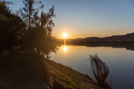 Sunset over the Orange river, on the border between Namibia and South Africa.の写真素材