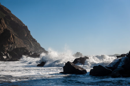 Late afternoon impression of Pfeiffer beach, California on a bright sunny afternoon as the sun is about to set.の写真素材