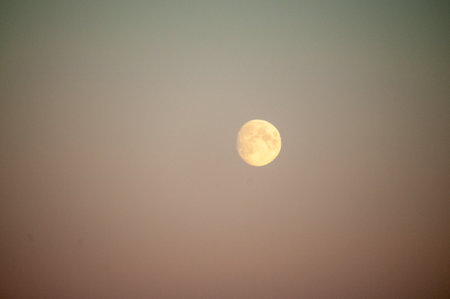 Close-up of a near full moon in arctic norway.の写真素材