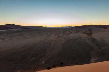 Exterior shot of the Namibian Sossusvlei sanddunes near the famous Dune 45 around sunriseの写真素材
