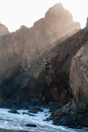 Late afternoon impression of Pfeiffer beach, California on a bright sunny afternoon as the sun is about to set.の写真素材