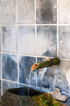 Hiroshima, Japan - January 2, 2020. Close-up of a bamboo faucet at the famour mitaki dera temple in Hiroshima.のeditorial素材
