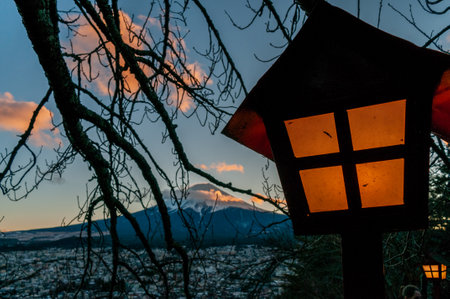 Shimoyoshida, Japan - December 27, 2019. Traditional Japanese lanterns illuminating mount fuji.のeditorial素材