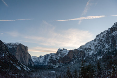 Panoramic view over Yosemite valley, from Tunnel view, showing a snow-covered valley at Dawnの写真素材