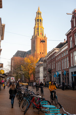 Groningen, the Netherlands - November 16, 2018. The A kerk, a famous church in the Groningen city center, seen here in golden hour light.のeditorial素材