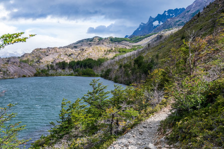 Impressive mountain view on a hike from Paine Grande to Refugio Grey, along lake grey in Torres Del Paine national park, Patagonia, Chile.の写真素材