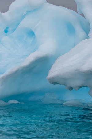 Detail of a patch of Antarctic sea ice, containing wonderous shapes and deep blue colours.の写真素材