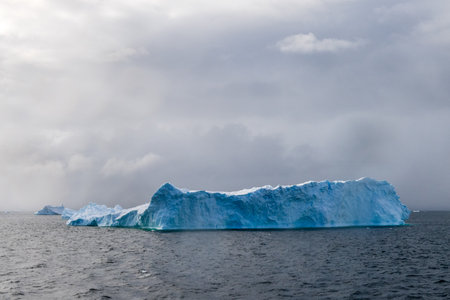 Icebergs off the Coast of the Graham passage, near Charlotte Bay, on the Antarctic Peninsulaの写真素材