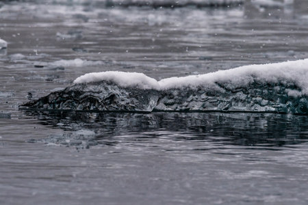 Detail of a patch of Antarctic sea ice, containing wonderous shapes and deep blue colours.の写真素材