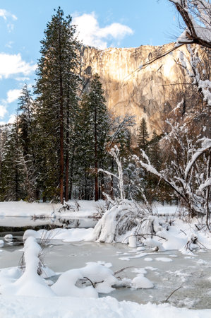 Exterior of the snow-covered valley floor of Yosemite National Park, on a bright sunny winter afternoon.の写真素材