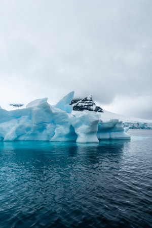 Detail of a patch of Antarctic sea ice, containing wonderous shapes and deep blue colours.の写真素材