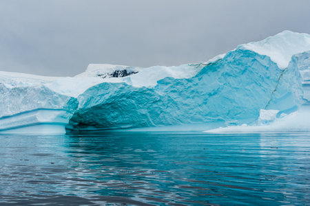 Detail of a patch of Antarctic sea ice, containing wonderous shapes and deep blue colours.の写真素材