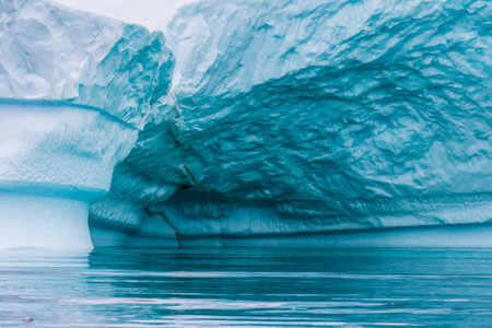 Detail of a patch of Antarctic sea ice, containing wonderous shapes and deep blue colours.の写真素材