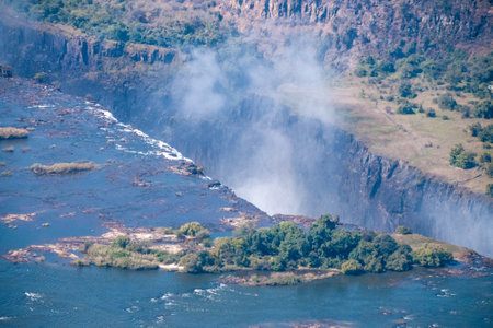 Telephoto shot of the immense Victoria falls, as seen from the air.の写真素材