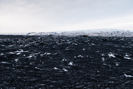 Impression of the black lava beaches near Solheimasandur along the icelandic south coast in Winterの写真素材
