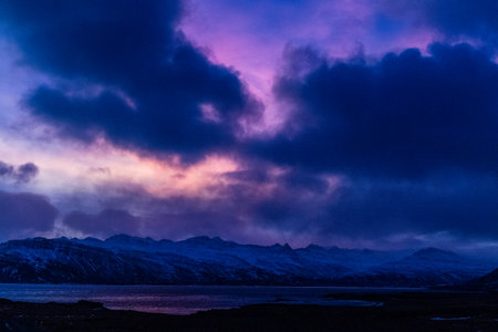 A stunning sunset along one of icelands fjords along the south east coastの写真素材