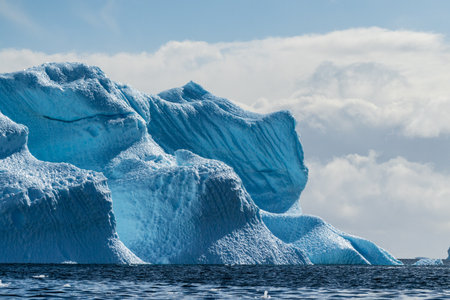 A tranquil Antarctic landscape, near Graham passage along Charlotte Bay, highlighting stark...