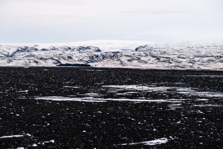Impression of the black lava beaches near Solheimasandur along the icelandic south coast in Winterの写真素材