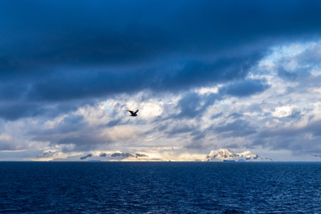 An Antarctic landscape, taken during the golden hour, just after sunrise, in the Gerlache Strait.の写真素材