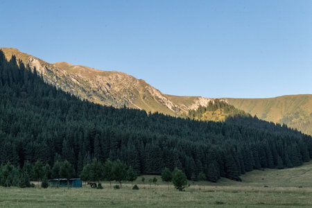 Impression of a sunrise over the mountains of Northern Kyrgyzstan.の写真素材