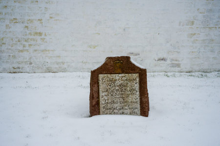 Soderborg Municipality, Denmark - February 8, 2017. Close-up of a gravestone covered with snow near the Danish town of Kvears in winter.のeditorial素材