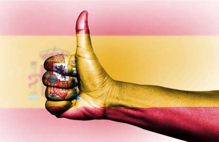 Flag raising on a thumb.の写真素材