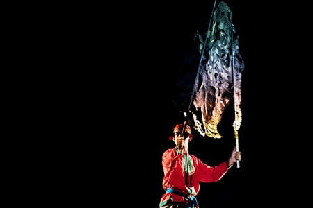 RATCHBURI, THAILAND - APRIL 13: Large Shadow Play is performed at Wat Khanon on April 13, 2011. The ancient performing art involves manipulating puppets of cowhide in front of a backlit white screenのeditorial素材