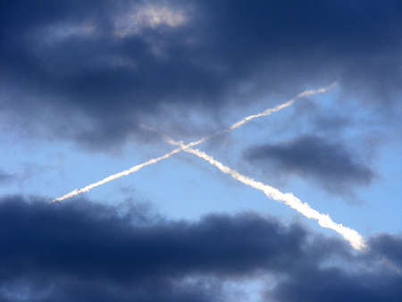 picture Crosses in the sky with clouds formed by cruising planes, Czech Republicの写真素材