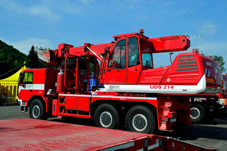 photo of a modern fire truck in the design of a universal finishing machine (UDS) on the occasion of a demonstration for the general publicの写真素材