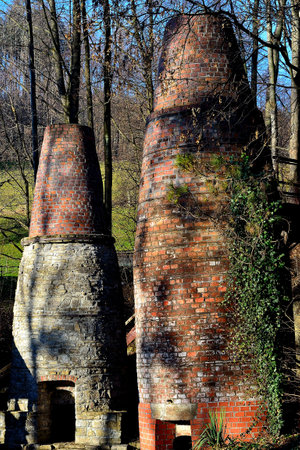 view of the historical technical monument of a pair of lime kilns with an access ramp for the production of lime for the metallurgical industry and construction, VendrynÄ, North Moravia, Czech Republiの写真素材