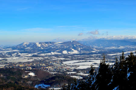 view of the snowy landscape of the foothills and peaks of the Beskydy Mountains, VelkÃ½ JavornÃ­k, northern Moravia, Czech Republicの写真素材