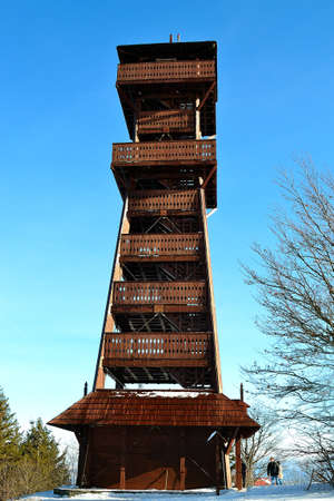 winter photo of a wooden lookout tower on the top of Velky Javornik in the Beskydy mountains, Czech Republicの写真素材