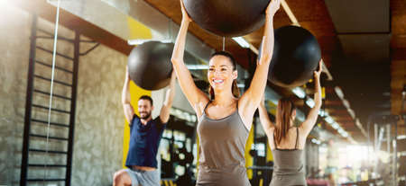 Exercising at gym with pilates ball.