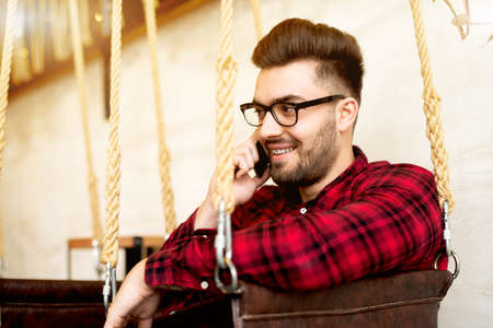 Handsome man talking on mobile phone.の写真素材