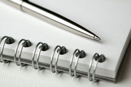 business notepad with pencil close up shootの写真素材
