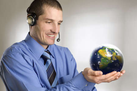 young business men holding planet earth close up