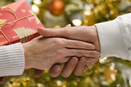 men and woman handshake close up for christmas
