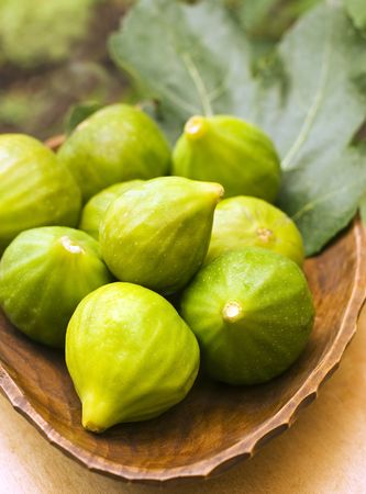 Fresh figs in a brown bowl close up shootの写真素材