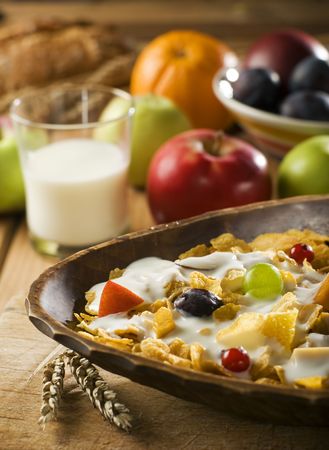 corn flakes with milk and fruit close upの写真素材