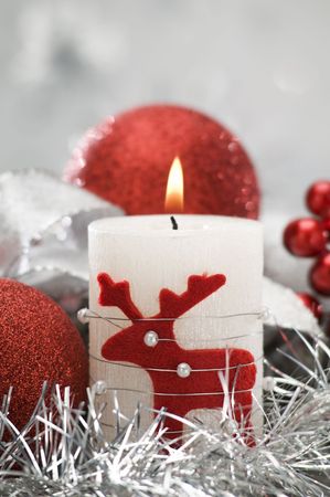 candle and christmas balls with shallow focus close up shootの写真素材