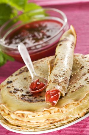 Fresh pancakes with strawberry jam close upの写真素材