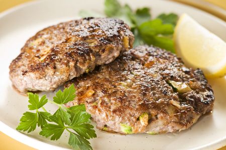 Beef steak with parsley and lemon close upの写真素材