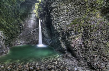 15 meter high Kozjak waterfall in Sloveniaの写真素材