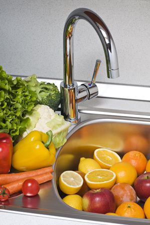 Fruits and vegetables prepared for washing close up shootの写真素材